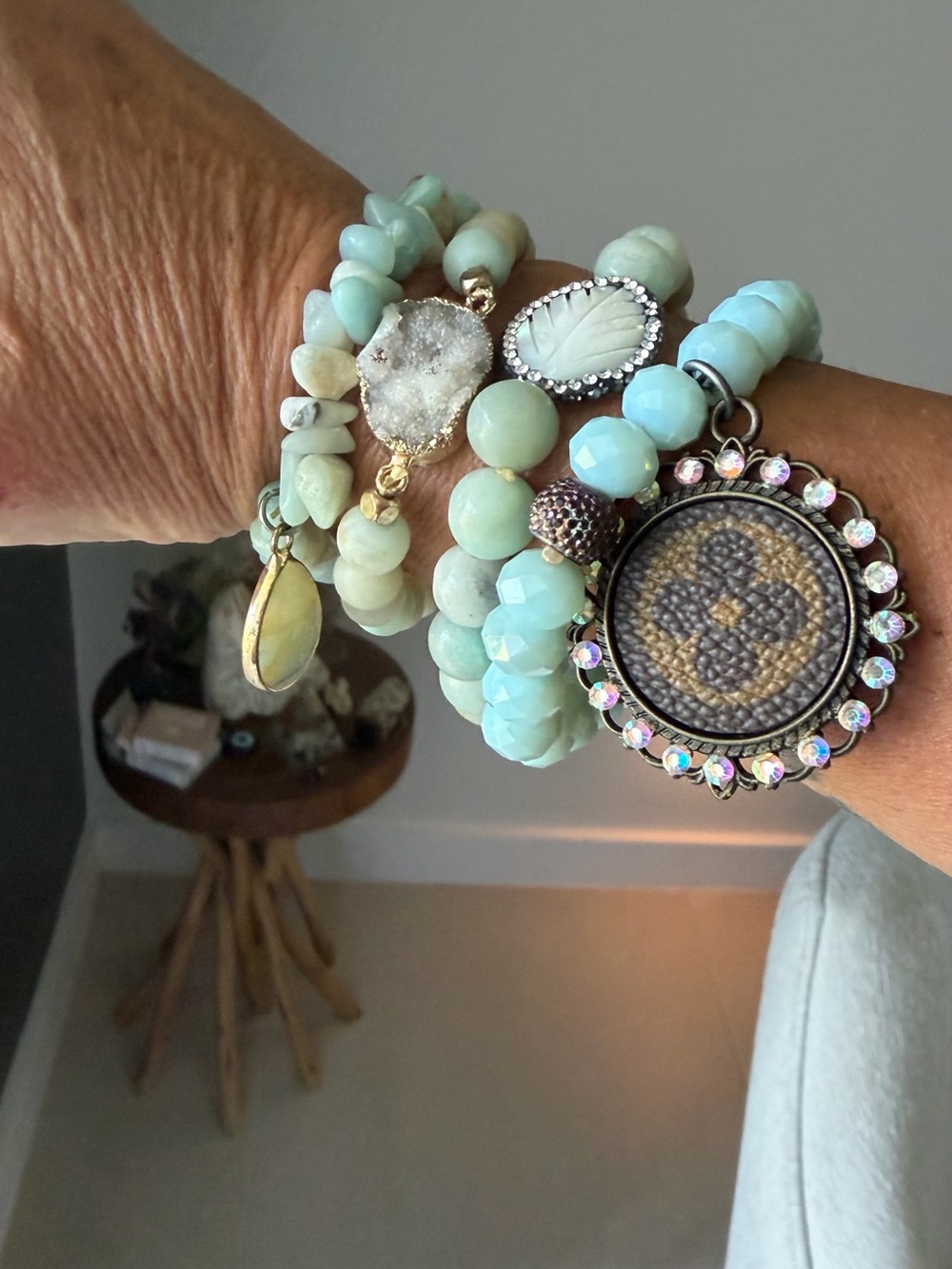 Handcrafted Mint Beaded Bracelet Stack with Crystal and Medallion LV bag.